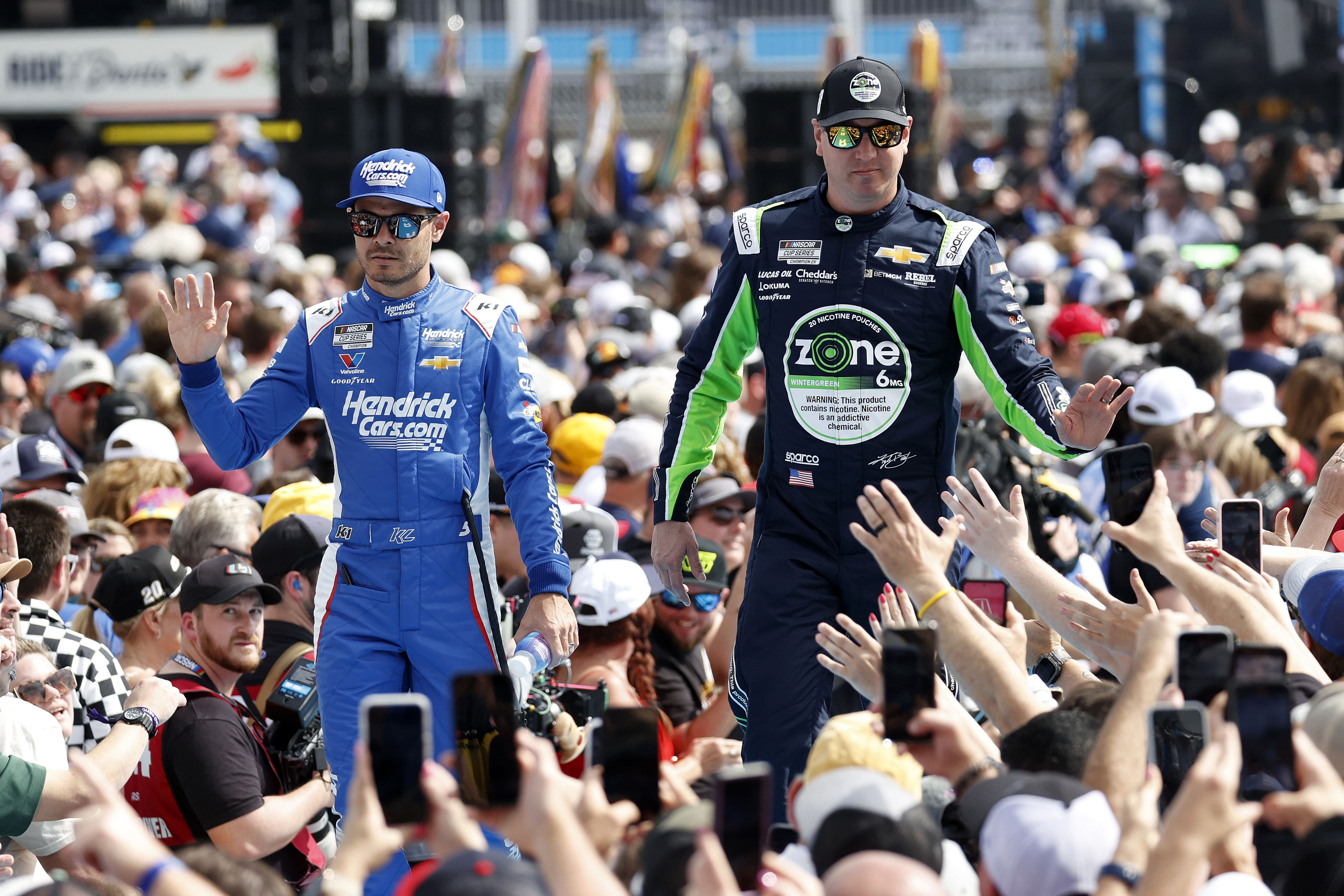 Kyle Busch (R) and Kyle Larson during drive introductions before the Daytona 500. Source: Imagn